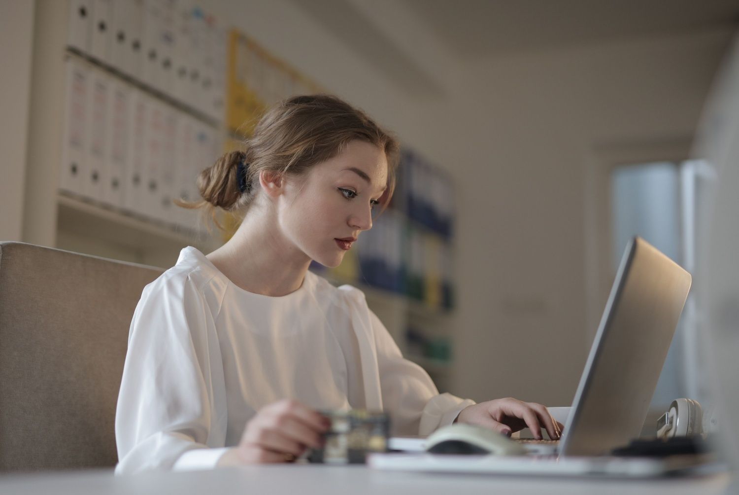 Nurse-browsing-job-listings-on-laptop---we-care-staffing (1).jpg